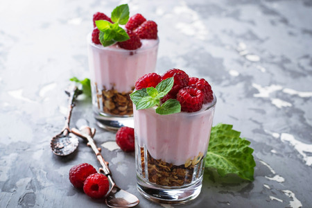 Dessert with granola, yogurt and raspberry. Selective focusの写真素材