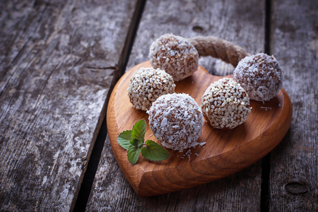 Raw vegan candies c with dried fruit and coconut. Selective focusの写真素材
