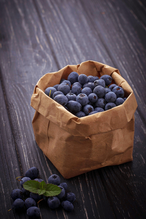 Fresh blueberries in paper bag. Selective focusの写真素材