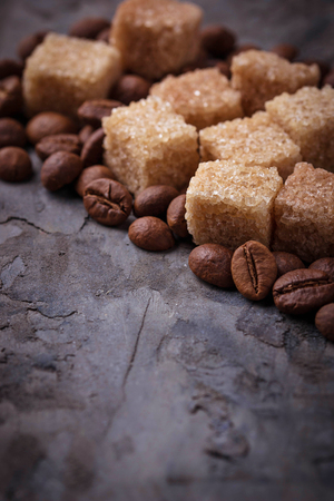 Brown cane sugar and coffee beans. Selective focusの写真素材
