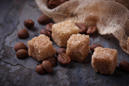 Brown cane sugar and coffee beans. Selective focusの写真素材