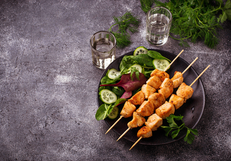 Chicken shish kebabs with green salad. Selective focusの写真素材