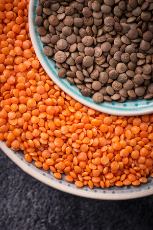 Bowls with red and black lentils. Selective focusの写真素材