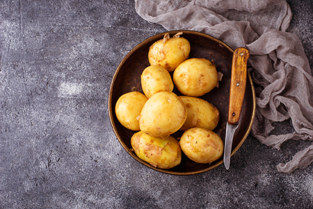 Raw potato in basket. Selective focusの写真素材
