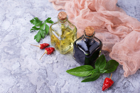 Olive oil and vinegar in glass bottles. Selective focus