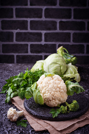 Assortment of cabbages on concrete backgroundの写真素材