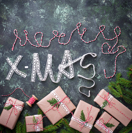 Gift box and text Merry Christmas from decorative ribbonの写真素材