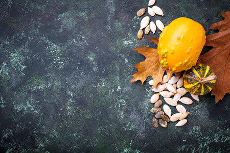 Raw and roasted pumpkin seeds. Selective focus