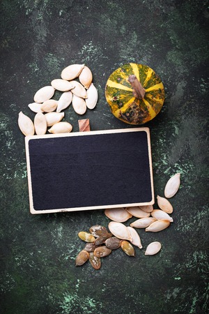 Raw and roasted pumpkin seeds. Top viewの写真素材