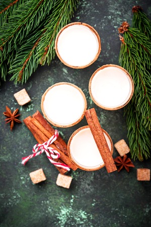 Christmas cocktail eggnog with cinnamon and grated nutmeg. Selective focusの写真素材