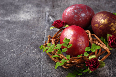 Easter painted red eggs on nest