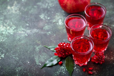 Glasses of fresh pomegranate juice. Selective focusの写真素材