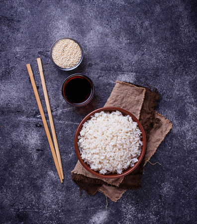 Bowl of boiled rice and chopsticksの写真素材