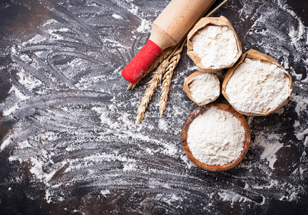 Wheat flour, ears and rolling pin. Top viewの写真素材
