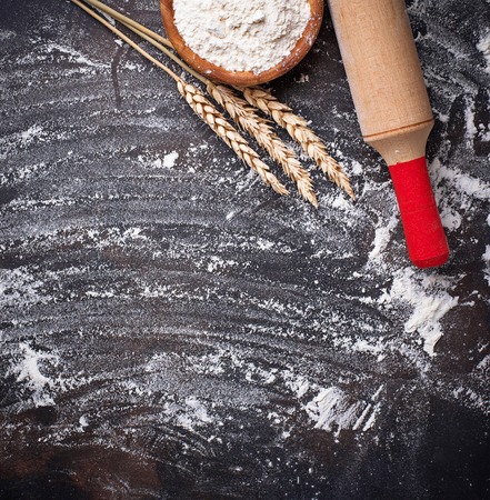 Wheat flour, ears and rolling pin. Top viewの写真素材