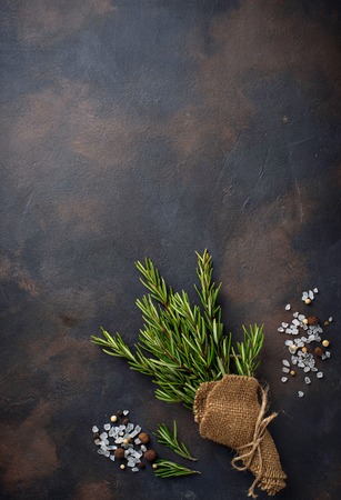 Bunch of fresh rosemary on dark backgroundの写真素材