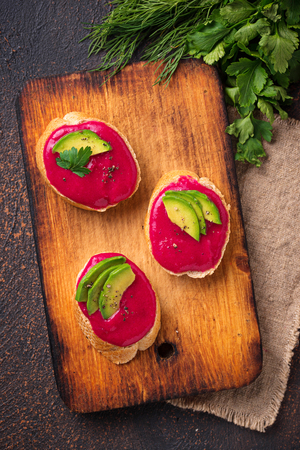 Healthy vegan toasts with beetroot hummusの写真素材