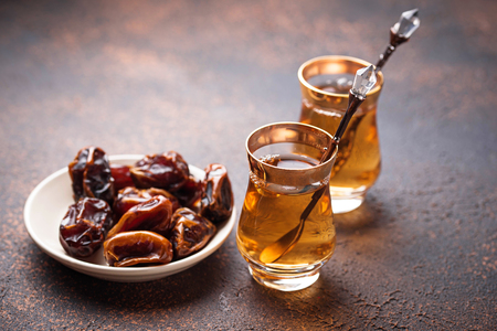 Traditional arabic tea and dry datesの写真素材