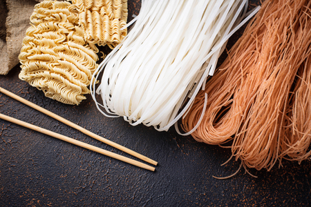 Different Asian rice noodles on rusty backgroundの写真素材