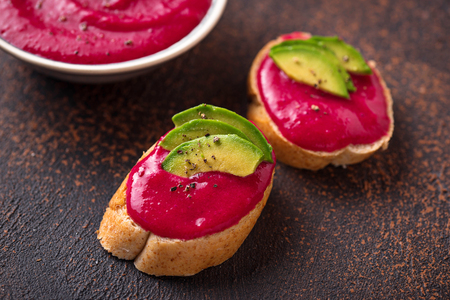 Healthy vegan toasts with beetroot hummus. Top viewの写真素材