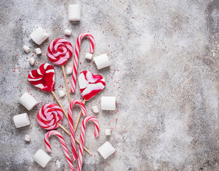 Pink lollipop, candy cane and marshmallowの写真素材