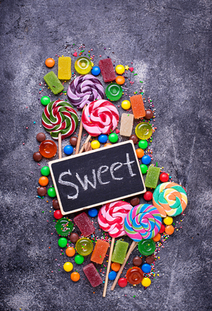 Assortment of colorful candies and lollipopsの写真素材