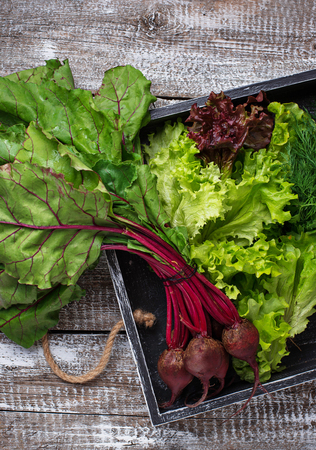 Beetroots, lettuce and parsley in wooden boxの写真素材