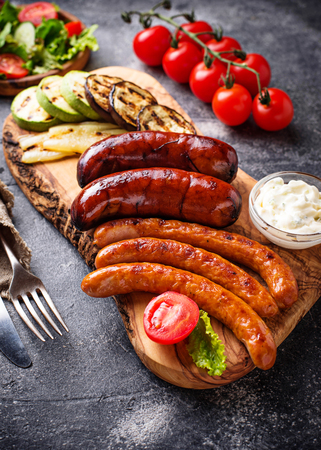Assortment of grilled sausages and vegetablesの写真素材