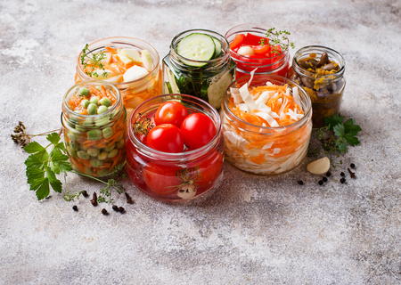 Fermented food. Preserved season vegetables in jars. Selective focusの写真素材
