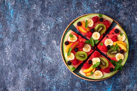 Watermelon pizza with fruit and berriesの写真素材