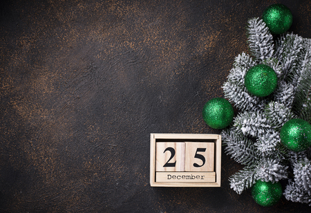 Christmas background with branch of tree and green ballsの写真素材