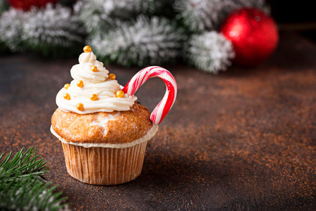 Christmas festive cupcake with  candy caneの写真素材