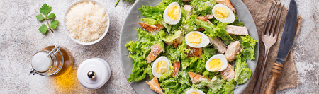 Caesar salad with eggs, chicken and parmesanの写真素材