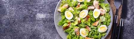 Caesar salad with eggs, chicken and parmesanの写真素材