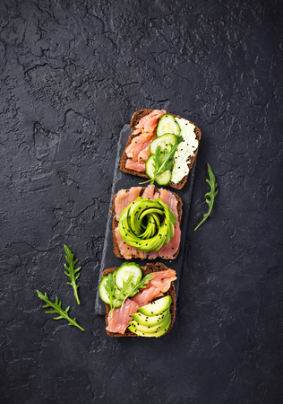 Avocado toast with salmon on rye breadの写真素材