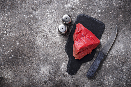 Raw meat on cutting board  with spices. Top viewの写真素材