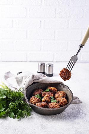 Homemade beef meatballs in frypanの写真素材