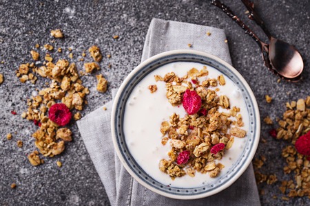 Granola with yogurt and dried raspberriesの写真素材