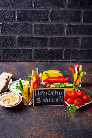 Snacks bar.  Vegetables sticks and hummusの写真素材