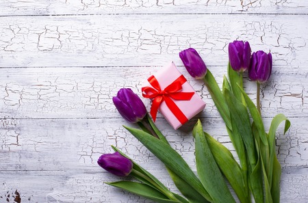 Tulips flowers and gift box. Festive backgroundの写真素材