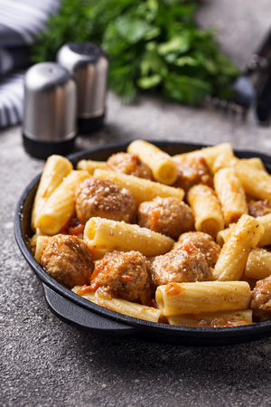 Pasta with meatballs in tomato sauce.の写真素材