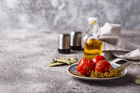 Homemade pickled tomato with spicesの写真素材