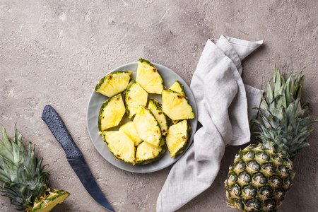 Fresh ripe sliced pineapple on plateの写真素材