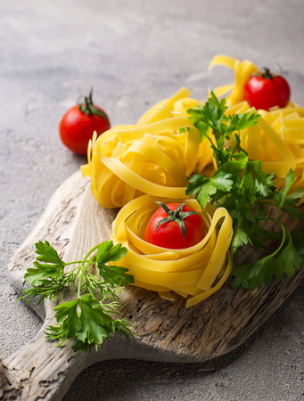 Raw uncooked homemade pasta tagliatelle or fettuccineの写真素材