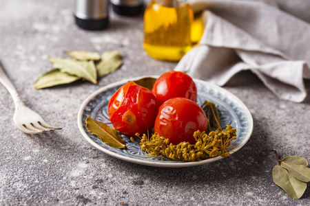 Homemade pickled tomato with spicesの写真素材