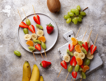 Fruit skewers, healthy summer snackの写真素材