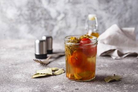 Homemade pickled tomato with spicesの写真素材