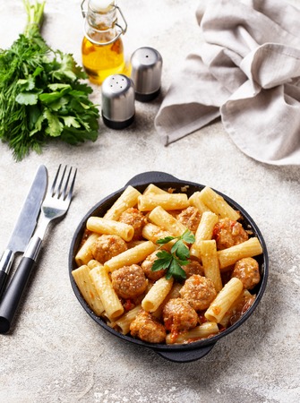 Pasta with meatballs in tomato sauce.の写真素材