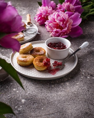 Homemade sweet roasted donuts with rose jamの写真素材