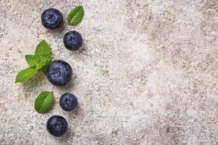 Fresh ripe blueberries on light concrete backgroundの写真素材